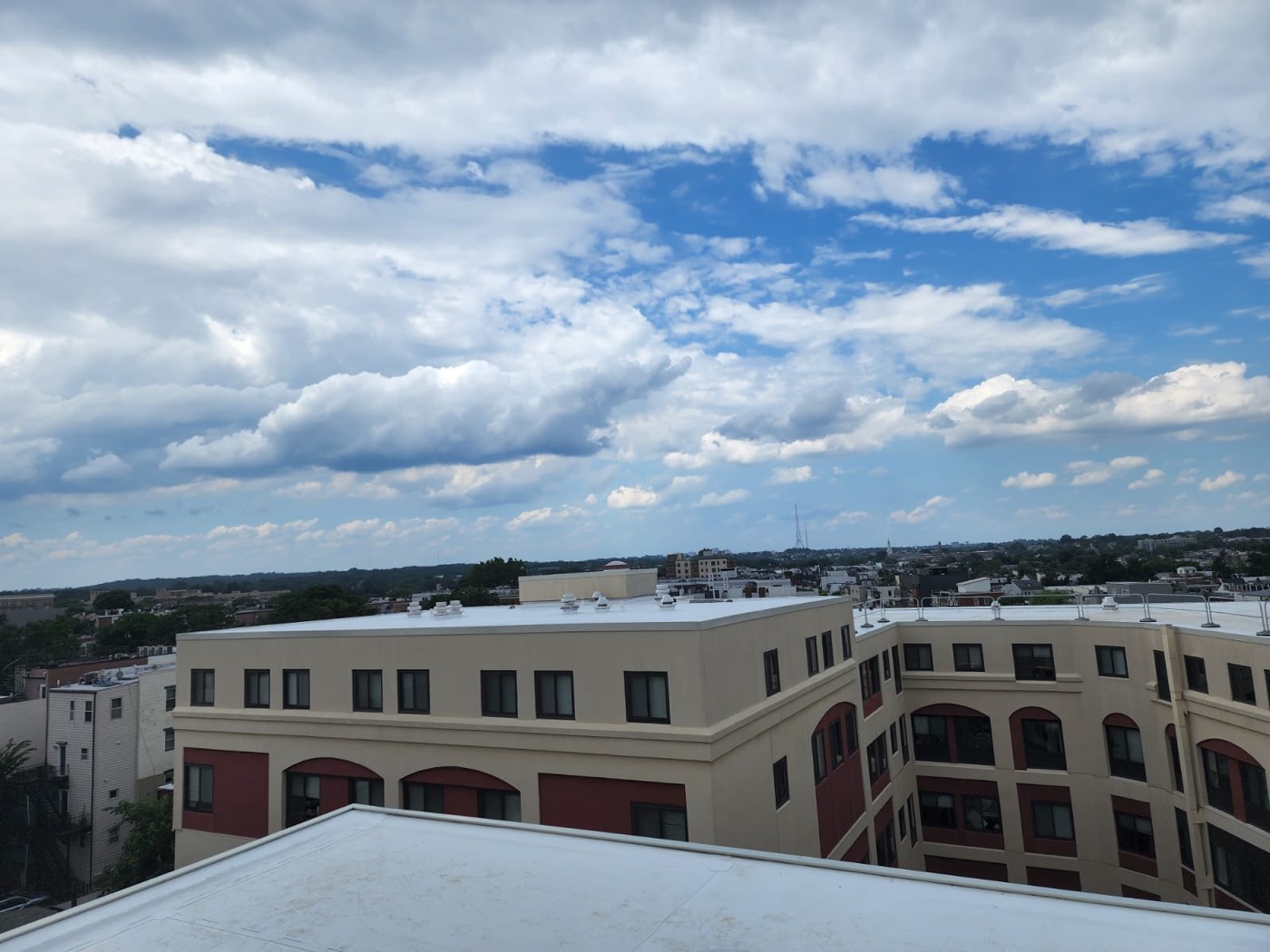 View across a commercial rooftop toward the surrounding Washington DC area skyline