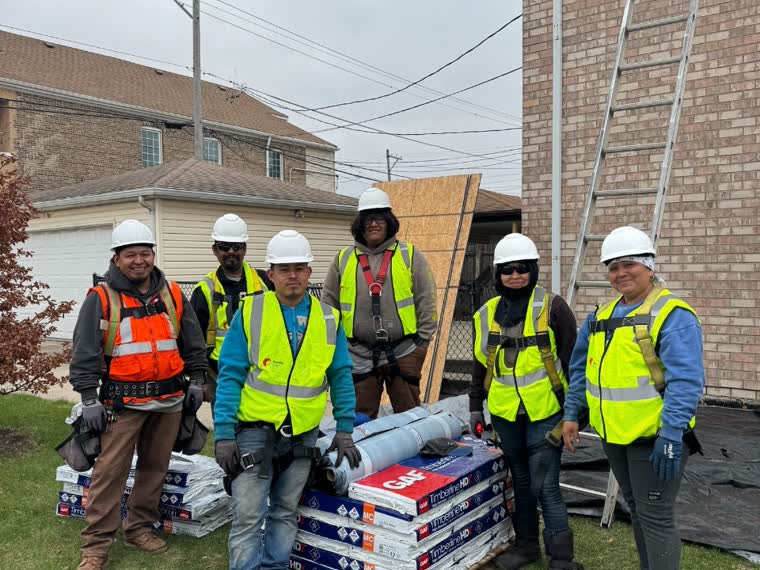Crew and staged material at the start of a job.