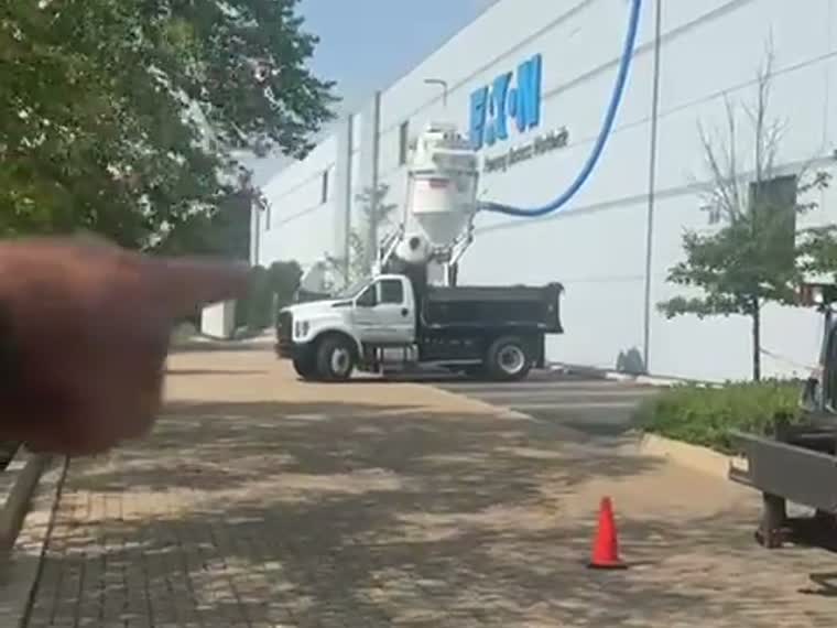 Boom truck and equipment staged on site.
