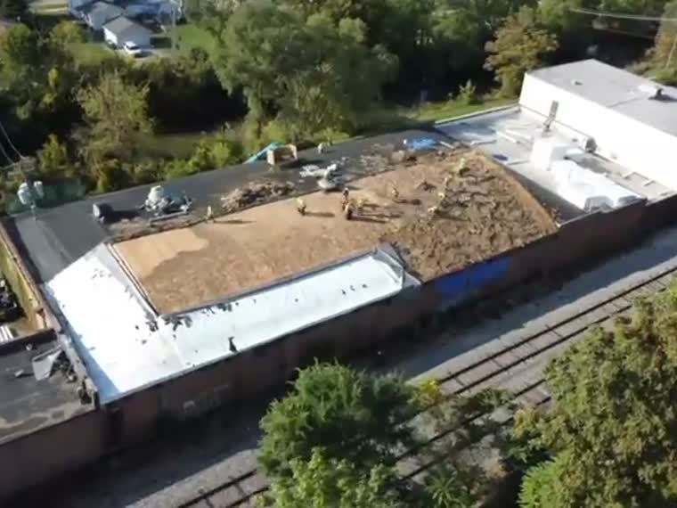 Roof field with the substrate exposed during work.