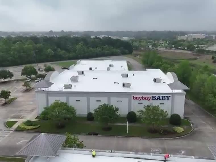 Retail centre roof under heavy overcast.