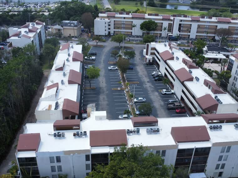 Reflective roofs across a multi-building residential property.