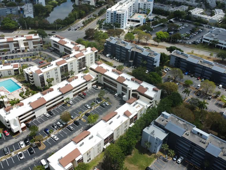 Courtyard elevation — roofs stepped across several building heights.