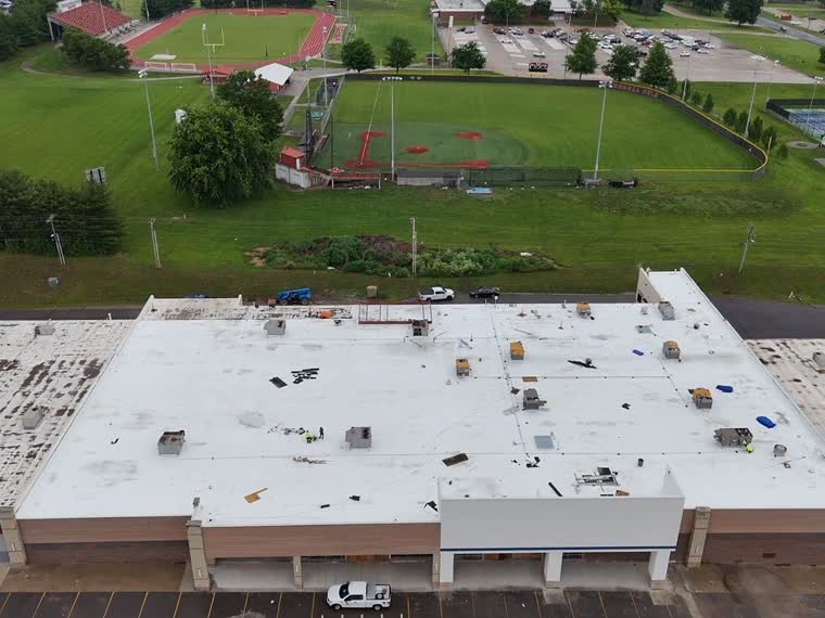 Completed roof adjacent to open playing fields.