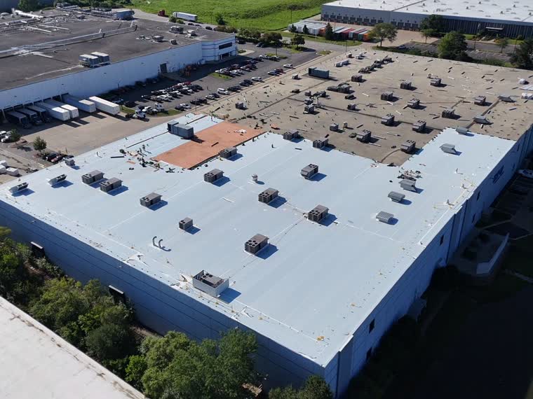 Large-format retail roof with dense rooftop mechanical equipment.