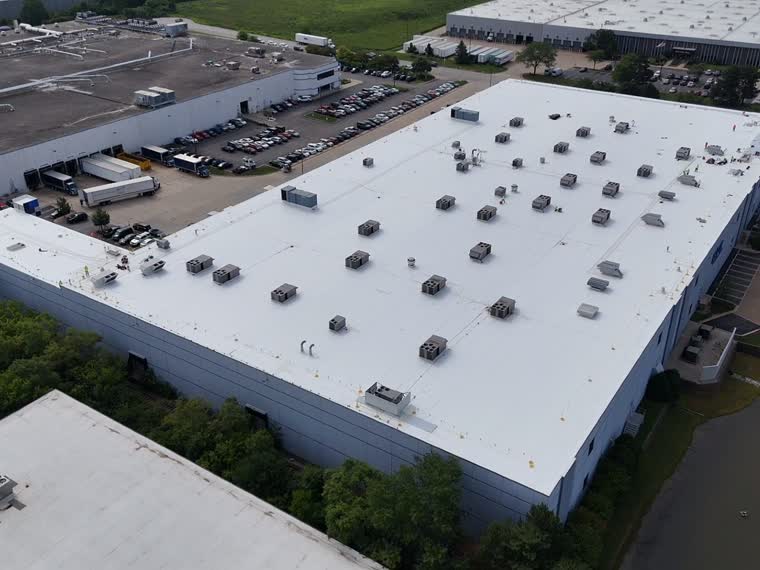 Large retail roof, mechanical units distributed across the field.