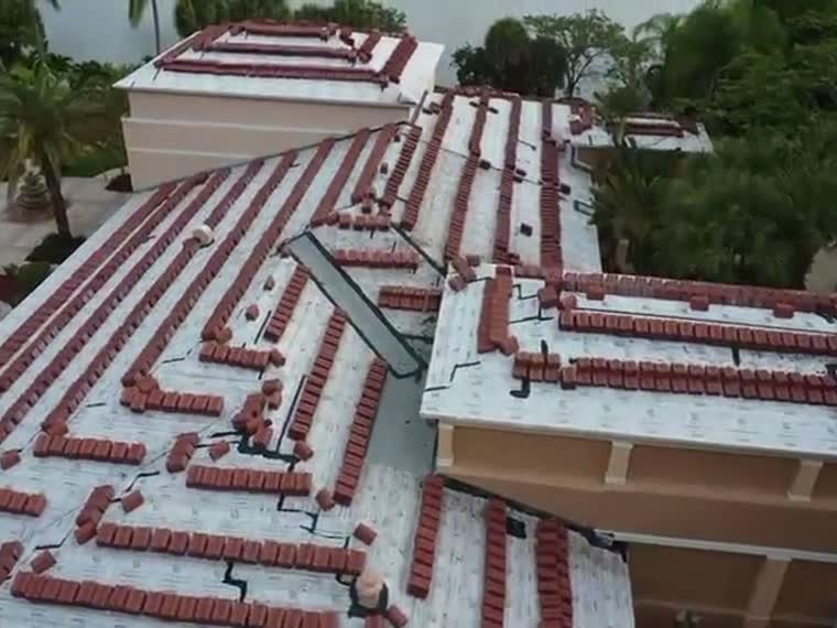 Aerial across barrel tile roofs.